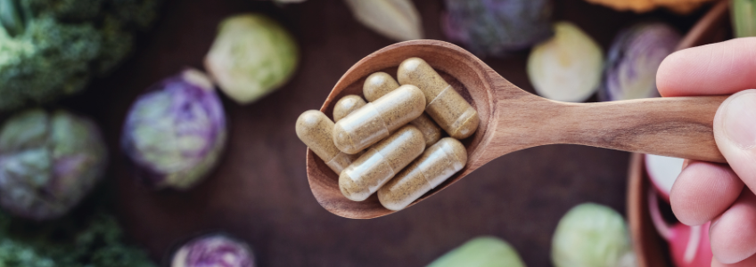 Colher com suplementos alimentares